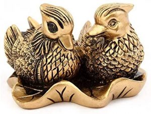 figura metálica de patos feng shui